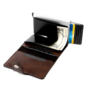 Detail of brown litchi leather RFID wallet with automatic metal card slot and money clip