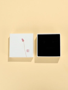 Minimalist jewelry box with lotus print and red seal showing interior velvet lining