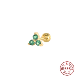 Detail of 925 sterling silver gold stud with green crystals in clover shape
