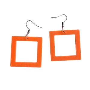 Detailed close-up of orange square acrylic earrings featuring polished geometric charms