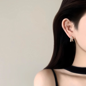 Elegant 14k gold plated double layer hoop earrings with zircons on model ear