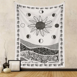 Detail of Nordic tapestry featuring mystical sun and moon patterns on a textured white wall