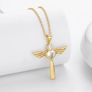 Detailed view of gold plated heart cross necklace with sparkling cubic zirconia crystals