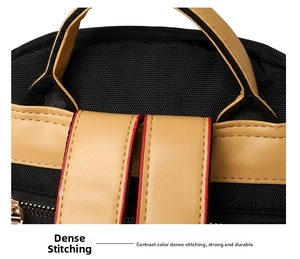 Detailed close-up of heavy-duty contrast stitching on black nylon and leather backpack