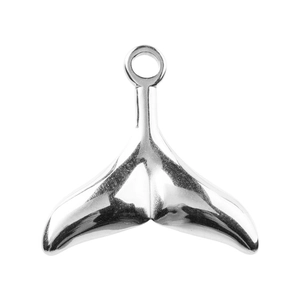 Macro shot of polished silver whale tail pendant with hanging loop for DIY jewelry