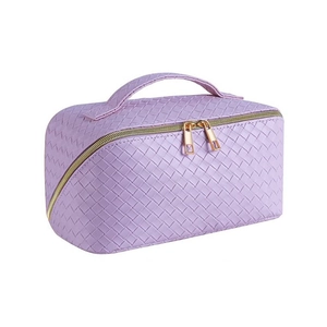 Large purple woven leather makeup bag with gold double zippers and top handle