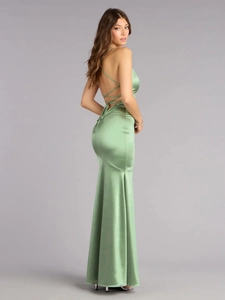 Detail of the open back design with crisscross straps on a green satin evening gown