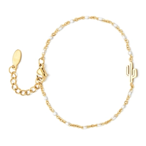 Detail of bohemian gold bracelet featuring a white bead and cactus charm with lobster clasp