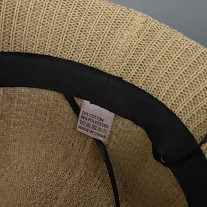 Detail of knit bucket hat interior showing 70% cotton 30% polyester material label
