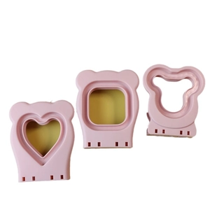 Pink heart, square and bear-shaped sandwich cutters made of stainless steel and plastic