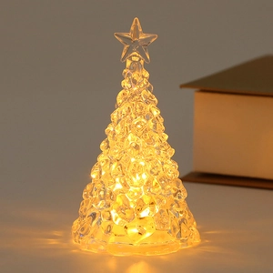 Close-up of LED mini Christmas tree crystal light with warm glowing star top