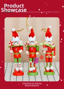 Close-up of three wooden Christmas nutcracker elf figurines with festive red and green decor