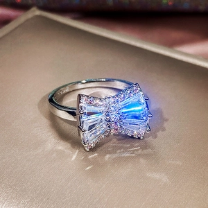 Close-up of silver bow ring with shimmering cubic zirconia and S925 hallmark