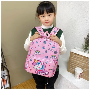 Pink unicorn backpack with rainbow patterns and LOVE text shown worn by a little girl