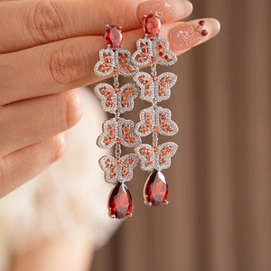 Boucles d'oreilles vintage papillon en argent avec grandes gouttes de rubis rouges