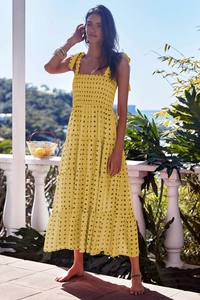 Detail of yellow tiered maxi dress featuring smocked bodice and thick shoulder straps