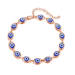 Detail of rose gold evil eye bracelet with adjustable chain and thirteen blue charms