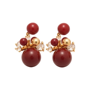 Luxurious red zircon fireworks earrings with gold-plated spheres on a clean white background