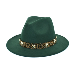 Close-up of dark green wool fedora hat featuring leopard ribbon and gold metal studs