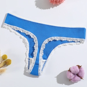 Detail of bright blue ribbed cotton thong with delicate white lace trim and bow accent