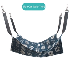 Hanging cat hammock with blue canvas fabric and metal hooks for pet cages