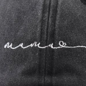 Black washed cotton baseball cap with white mama script embroidery detail for women