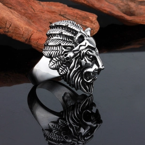 Punk rock lion head ring with Indian headdress in silver stainless steel on wood