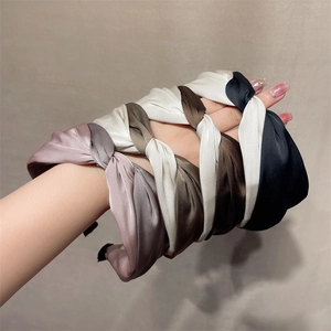 Elegant twisted wide-brimmed fabric headband for women in multiple soft satin colors