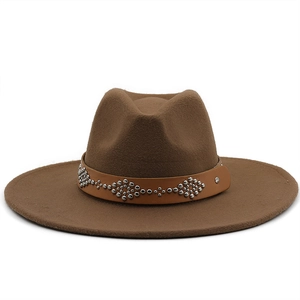 Detail of a brown wool fedora hat featuring a leather band with silver metal studs