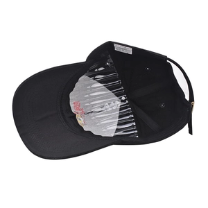 Detail of 100% cotton baseball cap interior showing reinforced lining and wash label