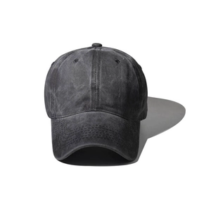 Detailed close-up of charcoal grey washed cotton baseball cap with reinforced visor stitching