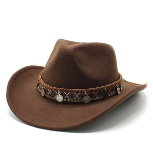 Detail of wool western cowboy hat featuring ethnic braided band and metal coin charms