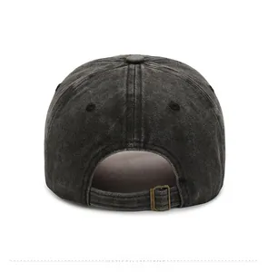 Detail of adjustable metal buckle on vintage washed cotton charcoal grey baseball cap