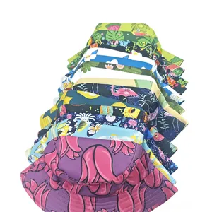 Close-up of assorted colorful patterned bucket hats with floral and tropical animal prints