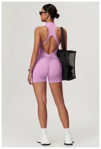 Detail of high-intensity yoga bodysuit featuring back cutout and scrunch butt lifting