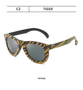 Detail view of tiger pattern camouflage glasses for kids party gifts at 45 degree angle