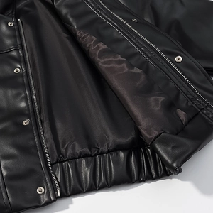 Slim fit black faux leather jacket with stand collar, silver zipper, and inner lining detail