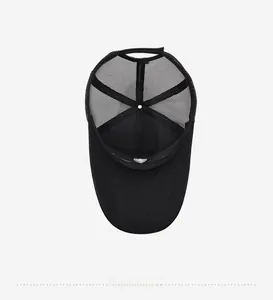 Detail view of the breathable mesh interior and sweatband of the black baseball cap