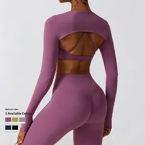 Ensemble de yoga violet 2 pièces avec haut à manches longues dos nu et legging taille haute