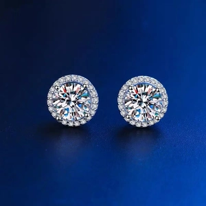 Macro detail of round halo zircon stud earrings with classic silver-tone setting