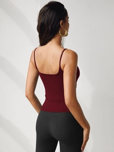 Detail view of deep red slim fit tank top featuring thin straps and backless design