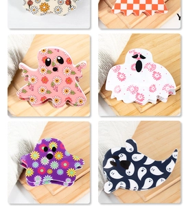 Detail of cute ghost hair claws in various patterns like floral, plaid, and sunflower