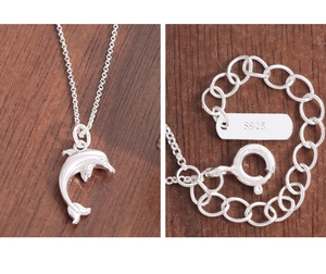 Macro detail of S925 sterling silver hallmark and clasp on dolphin pendant necklace