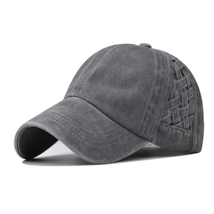 Detail view of washed cotton crisscross ponytail baseball cap in charcoal gray finish