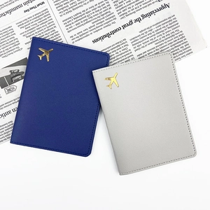 Travel passport holder set in blue and grey PU leather with gold airplane logo stamp
