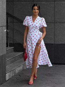 Detail view of white cotton wrap dress with red heart prints and side slit design