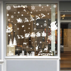 White Christmas window decals with reindeer, Santa, and snowflakes on glass display