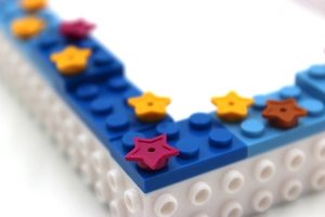 Macro view of a colorful starry sky themed building block photo frame for DIY crafts