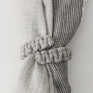 Handmade gray woven cotton curtain tieback featuring a minimalist Nordic style design