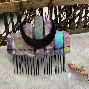 Close-up of handmade bridal hair comb with natural amethyst crystals and black moon decor